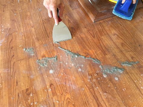 How do you remove dried wax from hardwood floors?