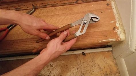 How do you remove hardwood staples?