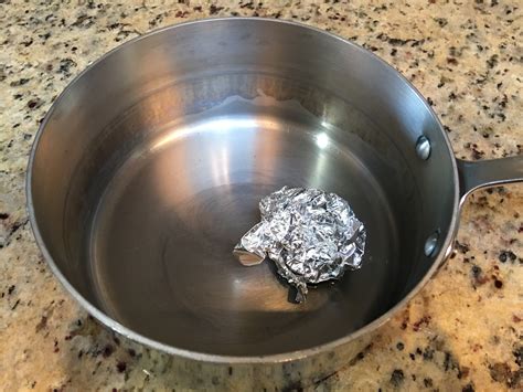 How do you remove milk residue from stainless steel?