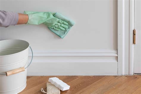 How do you remove stains from walls without damaging paint?