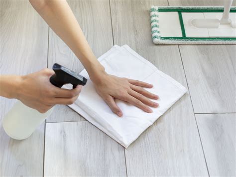 How do you remove sticky residue from laminate flooring?