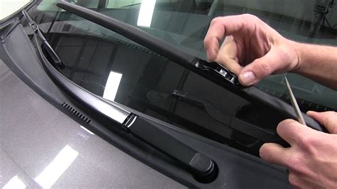 How do you reset a windshield wiper arm?