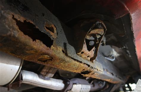 How do you save a rusty car frame?