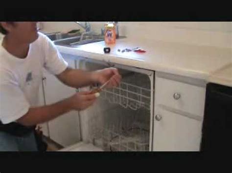 How do you secure a dishwasher under a countertop?