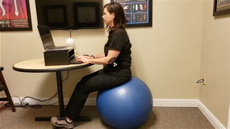 How do you sit up on an exercise ball?