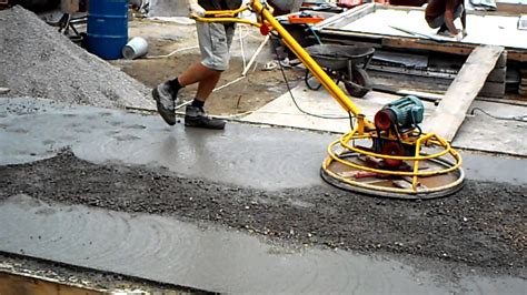 How do you smooth concrete by hand?