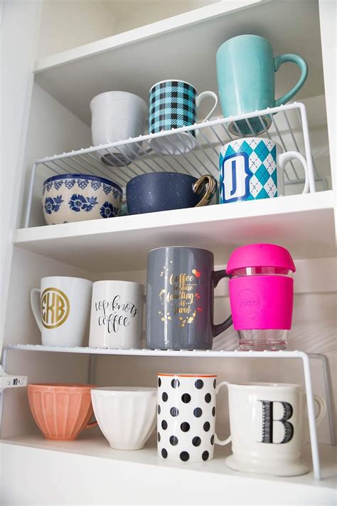 How do you stack mugs in a cupboard?