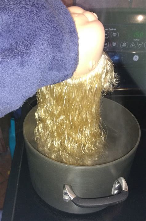 How do you straighten doll hair with boiling water?