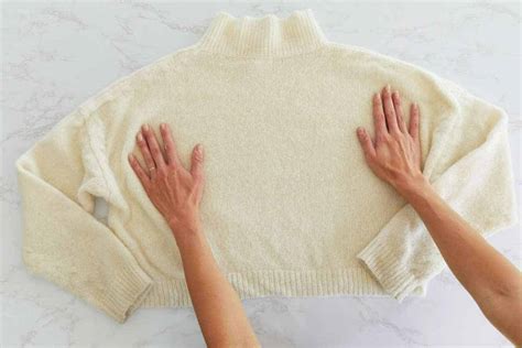 How do you stretch a sweater after washing it?