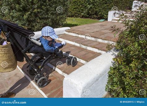 How do you take a baby stroller down stairs?