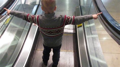 How do you take the pram down on an escalator?