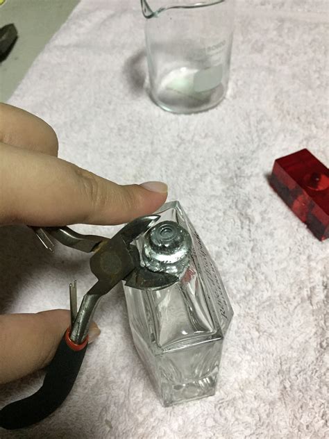 How do you take the top off a spray bottle?