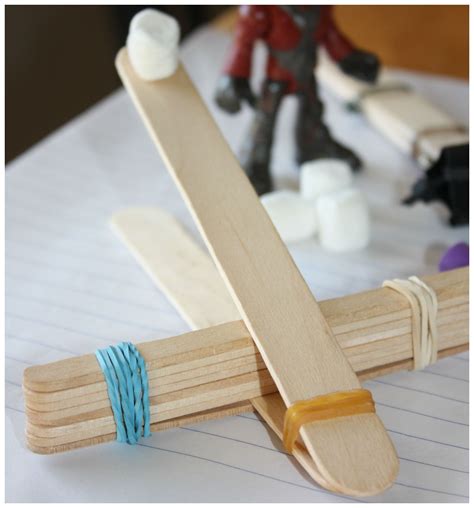 How do you tape popsicle sticks?