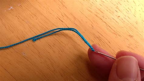 How do you thread and knot embroidery floss?