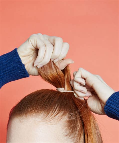 How do you tie a girl's hair?