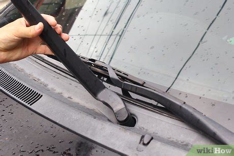 How do you tighten a loose windshield wiper arm?