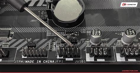 How do you turn on a motherboard with a screwdriver?