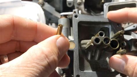 How do you unblock a carburetor jet?