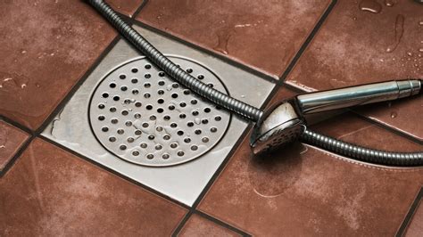 How do you unclog a shower drain with standing water?