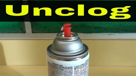How do you unclog a spray can nozzle?