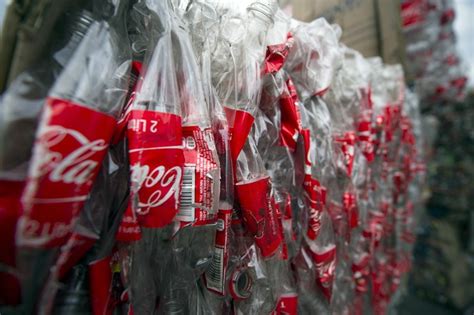 How does Coca Cola recycle plastic?