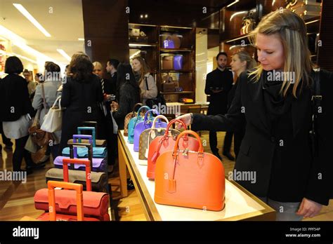 How does Louis Vuitton attract customers?