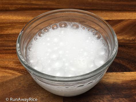 How does baking powder react with water?
