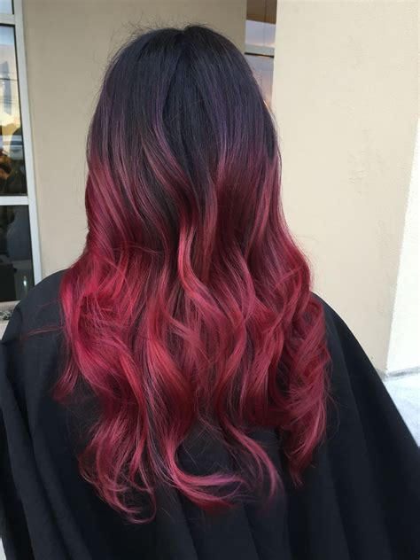 How does red dye fade on dark hair?