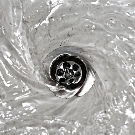 How long do you leave bleach in drains?