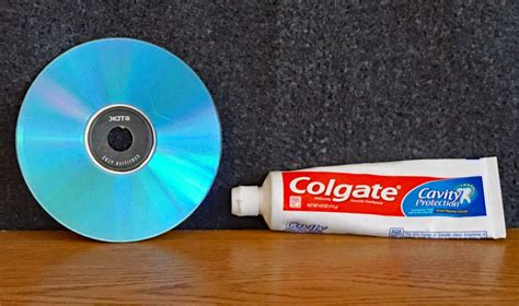 How long do you leave toothpaste on a scratched disc?