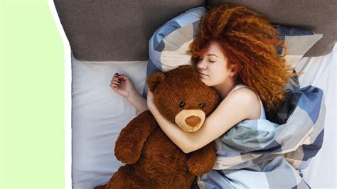 How many adults sleep with a cuddly toy?