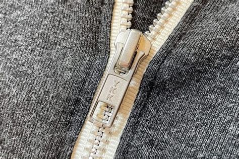 How much is the owner of YKK zipper worth?