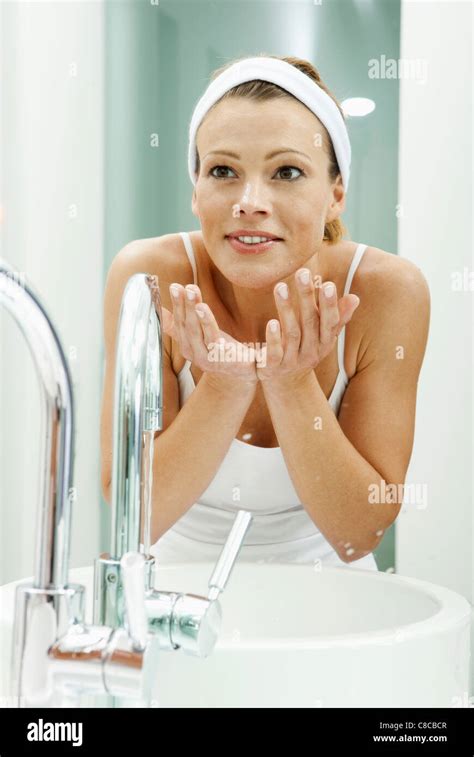 How often should an older woman wash her face?
