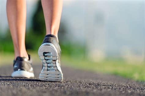 How should your feet hit the ground when running?
