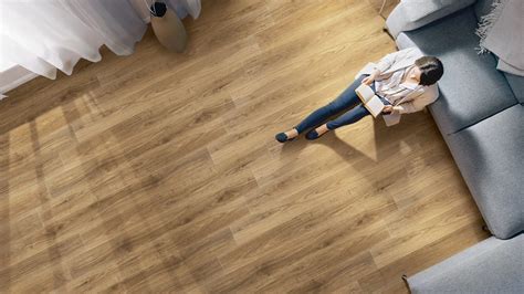 In what room should you avoid using wood floors?