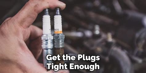 Is hand tight good enough for spark plugs?