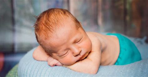 Is it OK for baby to sleep propped up on a pillow?