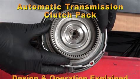 Is it OK to hold clutch in at red light?