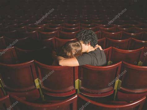 Is it OK to kiss in a movie Theatre?