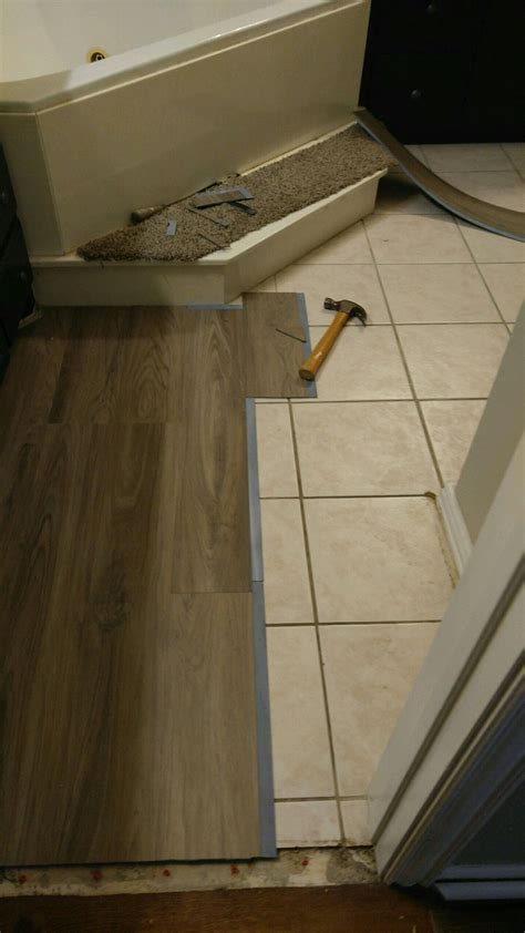 Is it OK to lay laminate over tile?
