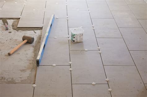 Is it OK to lay tile on concrete floor?