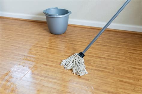Is it OK to mop wood floors with water?