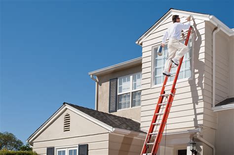 Is it OK to paint a house in the rain?