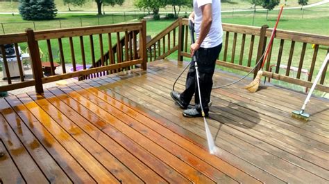 Is it OK to pressure wash a deck before staining?