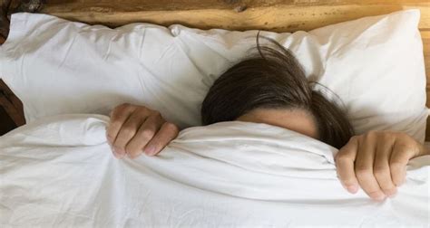 Is it OK to sleep with a sheet over your head?