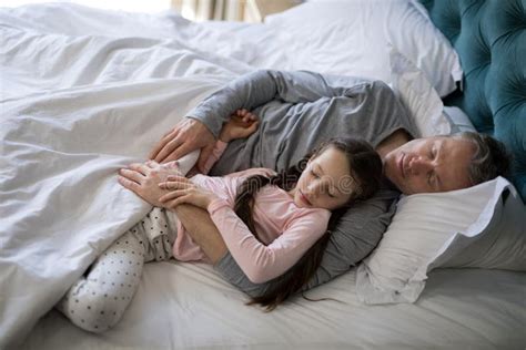 Is it OK to sleep with my daughter?