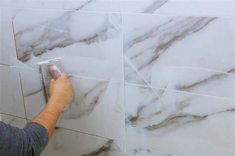 Is it OK to tile without grout?