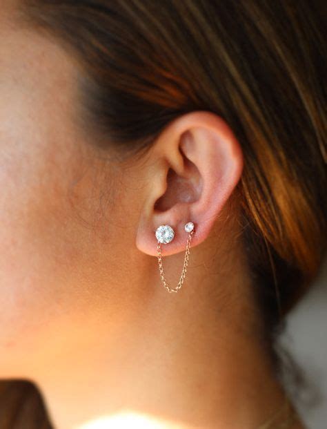 Is it OK to wear 2 earrings in one hole?