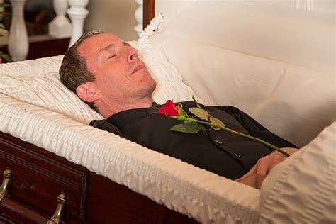 Is it bad to touch a dead person in a casket?