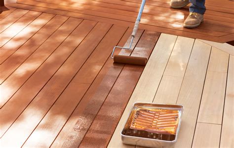 Is it better to brush or roll stain on a deck?